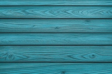 Close-up of blue painted wooden planks with visible natural wood grain patterns and texture