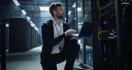 Technician uses a laptop of server rack systems in a data center, analysis of device connections, network cables, electronics for secure business infrastructure, it service, and software operation. - Powered by Adobe
