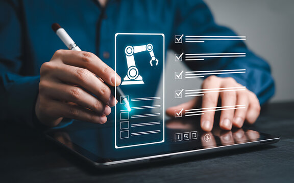 Person using a stylus on a tablet with a holographic interface showing a robotic arm and a checklist, representing automation and task management