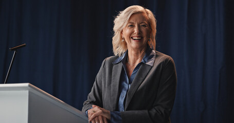 Podium, politics and portrait of mature woman on stage for democracy, election or government...