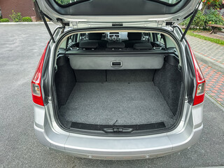 Spacious and organized trunk of a car ready for a road trip in a scenic area during a bright sunny day