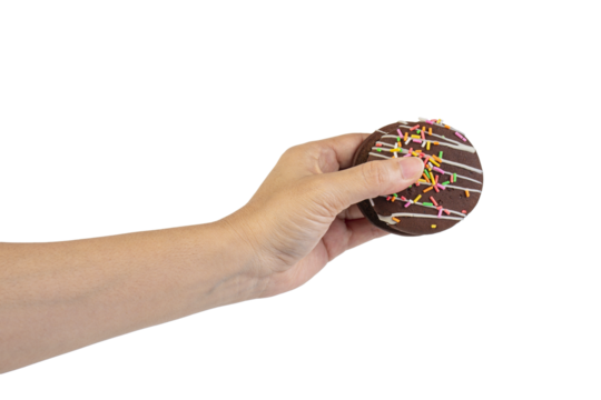 Mint filled chocolate chip cookies in hand on transparent background