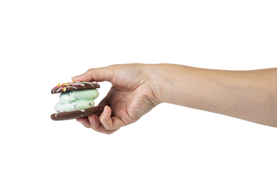Mint filled chocolate chip cookies in hand on transparent background