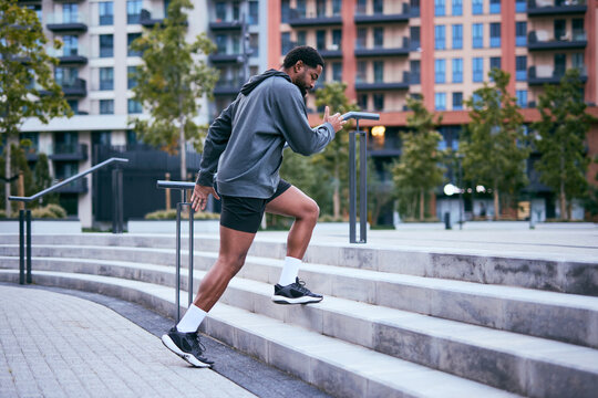 Athlete Climbing Steps in Urban Park During Workout Session