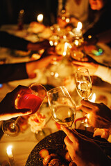 Celebration at a festive table with glasses raised