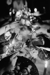 Celebration with toasting glasses on festive table