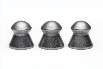 Three identical metallic air rifle pellets with smooth rounded heads standing upright in a row on a white background