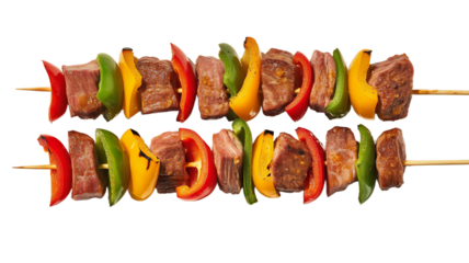 Two beef and vegetable skewers with red, green, and yellow peppers isolated on transparent background