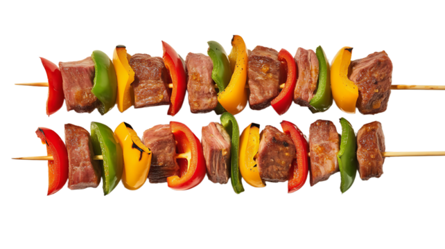 Two beef and vegetable skewers with red, green, and yellow peppers isolated on transparent background