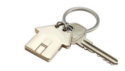 Shiny key and house keychain lie on black, silver and white, symbolising home, security, and property ownership