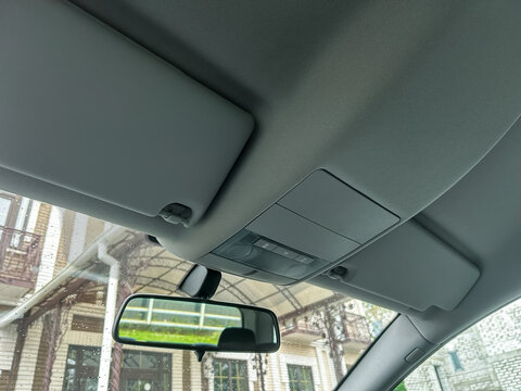 Exploring the unique textures and features of a car interior while parked in a vibrant urban location