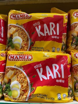 Paka, Malaysia - 23.10.2025 : Mamee Perisa Kari instant noodle packs displayed for sale