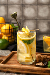 Fototapeta premium Glass of infused water with lemon on table
