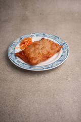 asian spring roll on a plate with stone backround