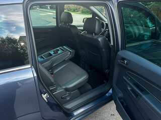 Exploring the spacious interior of a modern SUV with roomy seating and practical design elements...