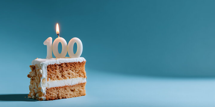 A delicious slice of cake with a candle in the shape of the number 100 on top