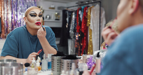 Drag artist, lipstick or person with mirror in dressing room, getting ready or queer culture for show. Stage makeup, transformation or performer apply color for preparation, reflection or backstage