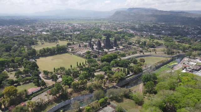 Aerial view of the majestic Prambanan Temple with its dark spires rising from the lush green landscape, Yogyakarta, Yogyakarta, Indonesia.