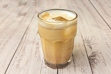 Cold-filtered iced latte with double espresso, cold-steamed whole milk, and latte art on top