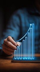 Businessman hand draw upward pointing arrow virtual graph symbolize success business growth progress  financial improvement.