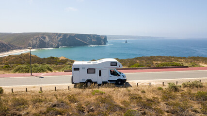 Motorhome parked on scenic coastal road in aljezur, portugal