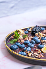 A post-workout breakfast is visualized with this hearty mix of blueberries, high-protein cereal, and cottage cheese with a hint of vanilla