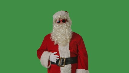 Close up portrait of Santa Claus with a white curly beard, wearing a red hat and suit, on a solid green chroma key background. Ideal for Christmas-themed compositions, advertising, and holiday mockups