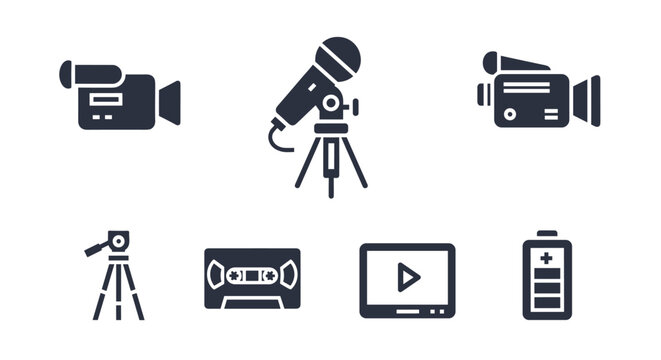 Collection of six solid, filled icons representing video recording and related equipment, including a video camera, microphone on a tripod, vintage video tape, a monitor with a play button, and a