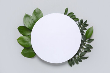 Blank card with different fresh green leaves on grey background