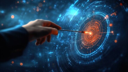 Close-up of a hand holding a glowing pointer touching the center of a futuristic digital circular interface with blue and orange light effects