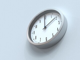 Silver wall clock on the wall from below view. 