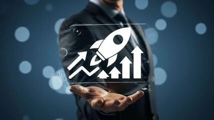 Close-up of a businessman in a dark suit presenting a digital display of a white rocket launch icon with upward trending graph on a navy bokeh background. - Powered by Adobe