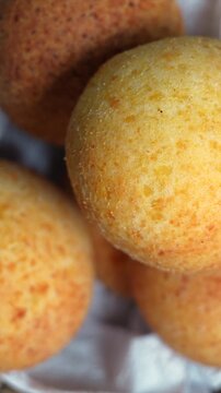 A close-up shot of golden almohabanas under warm lighting, showcasing their texture. Perfect for vertical video formats like social media stories. Vertical video.