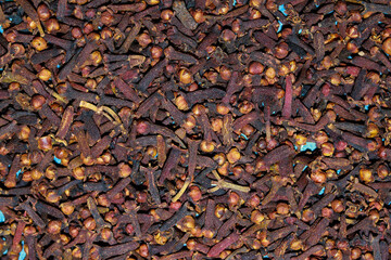 Dry cloves background. Close up of a pile of dried cloves