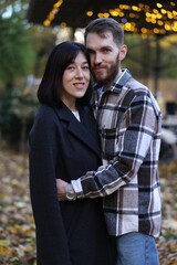 Fototapeta premium Happy couple hugging in autumn park. Romantic relationship