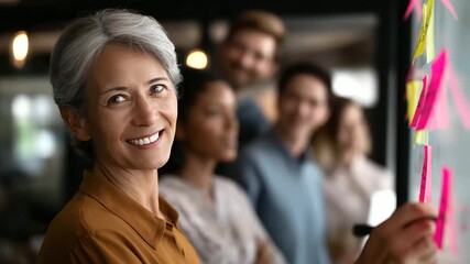 A diverse team collaborates with sticky notes on a whiteboard a leader fostering engagement hyper realistic notes with vivid text moody shadows in a modern office bright satura - Powered by Adobe