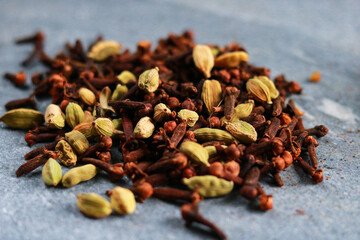 Aromatic spices. Cardamom and clove closeup