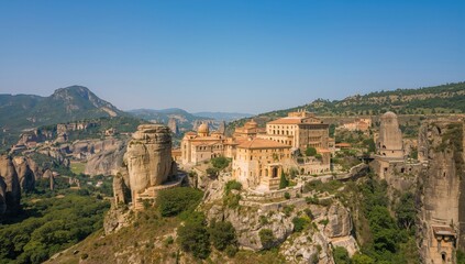 Naklejka premium Medieval cliffside monasteries nestled in mountainous terrain with stunning architecture