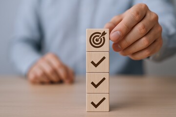 Achieving goals with a checklist and aiming for success by placing wooden blocks