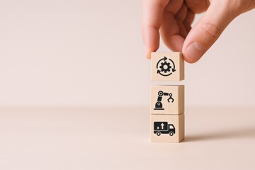 Manufacturing Process Automation: Hand Placing Blocks Representing Supply Chain, Production and Logistics, Streamlining Efficiency