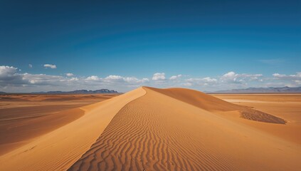Majestic Sand Dunes with Undulating Textures Beneath a Bright Blue Sky, Erosion Risk