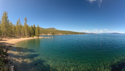 Breathtaking lake surrounded by towering pine trees, natural beauty,