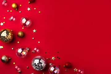 Festive Christmas ornaments on a red background.