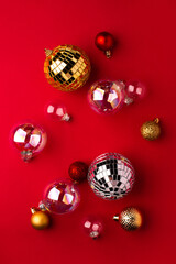 Festive Christmas ornaments on a red background.