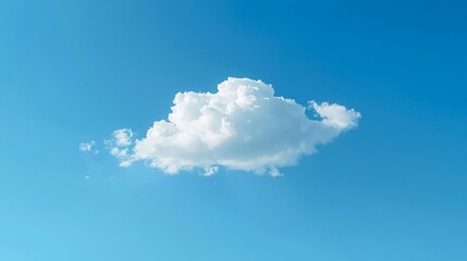 Serene white cumulus cloud floats peacefully against a vast, clear azure sky, evoking a sense of freedom and possibility