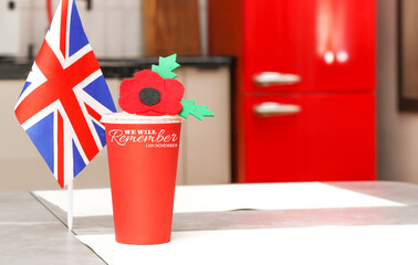 Poppy Day in home background. Remembrance Day - Lest We Forget.  Flag of Great Britain.