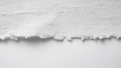 Close-up of a raw fabric edge, showcasing a rugged texture, ideal for textile design applications