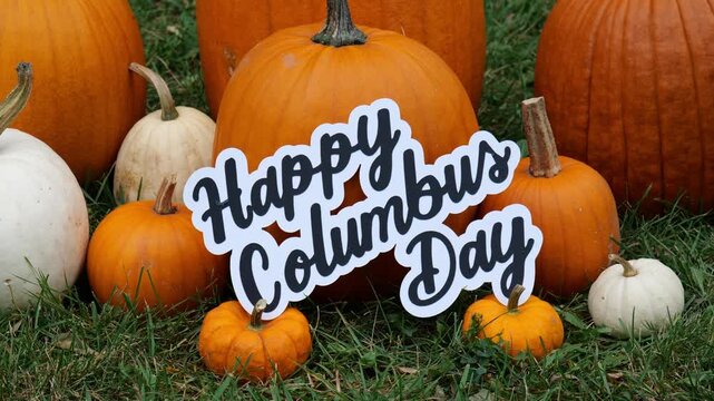 Person sets the wording Happy Columbus Day on a Pile of Pumpkins at a Pumpkin Patch 4K Video Stock Footage