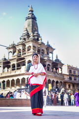 Obraz premium Nepali Newari Girl in Traditional Attire Gracefully Posing for Photoshoot at Patan Durbar Square