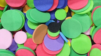 Colorful foam circles creating an abstract craft background